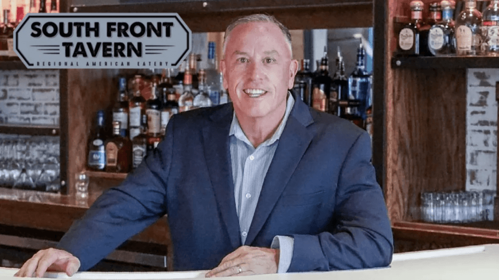 Owner Mark Zecher welcoming guests at South Front Tavern anniversary celebration in Wilmington NC