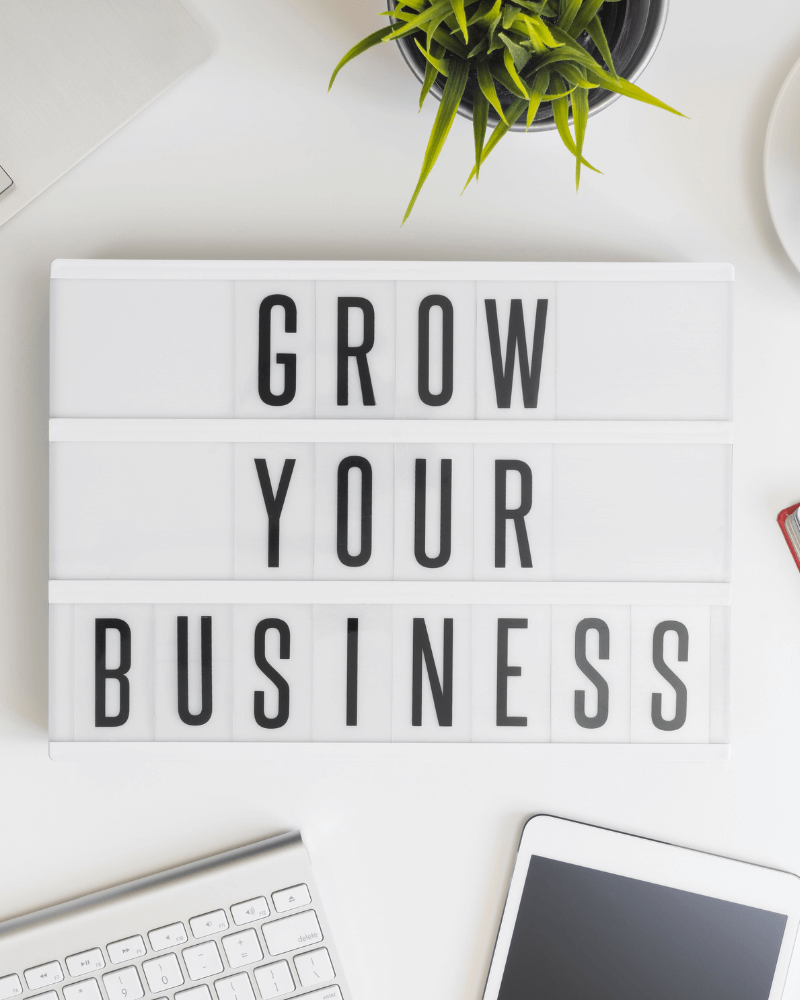 The word “Business” in bold letters, representing independent ownership, entrepreneurship, and growth opportunities in Wilmington, NC.